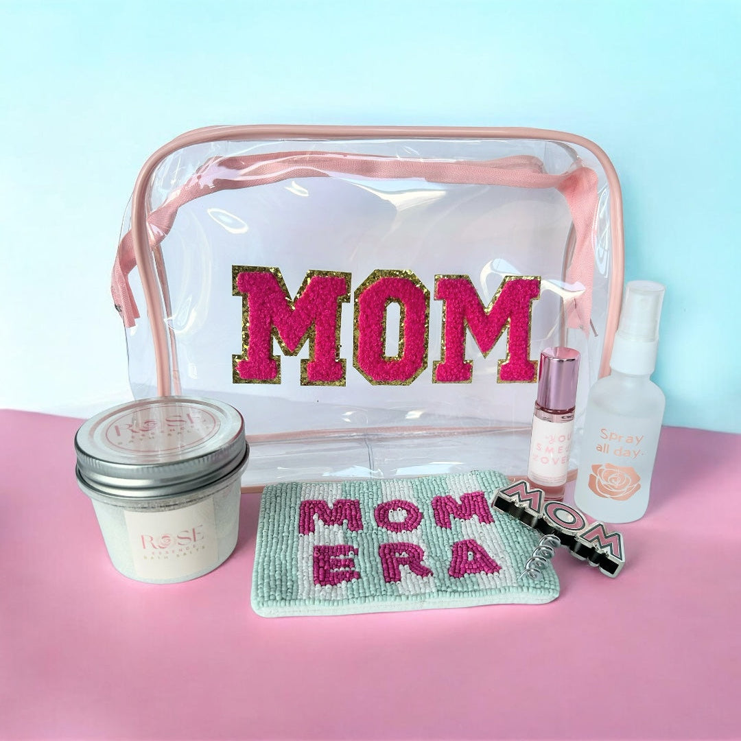 Mom Era wellness gift bundle with rose bath salts, rose face mist, MOM cosmetic bag, Mom Era Beaded change purse, botanical perfume and mom wine opener.