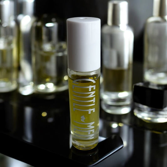 GentleMen roll-on cologne standing upright with masculine fragrance styling and moody luxury background.