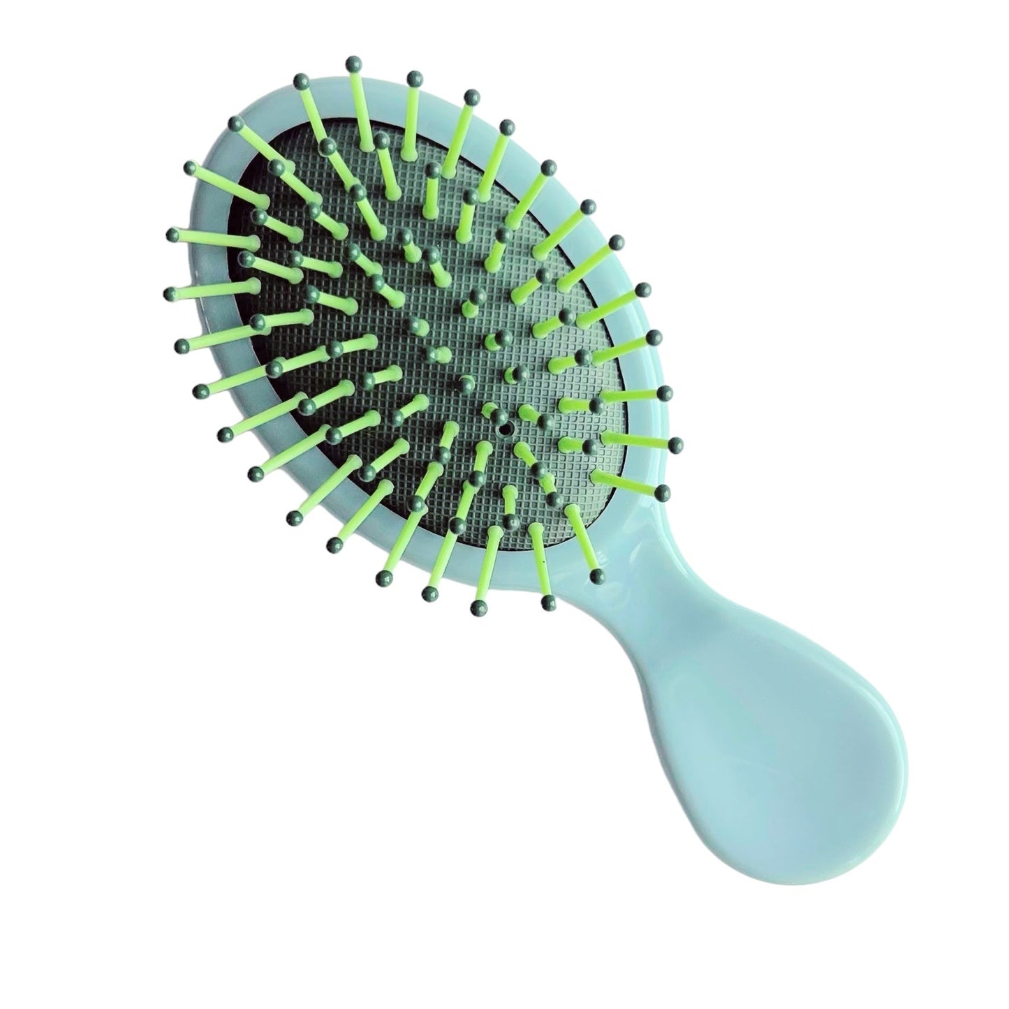 Blue and green mini detangling hair brush, a fun self-care addition to a wellness gift bundle