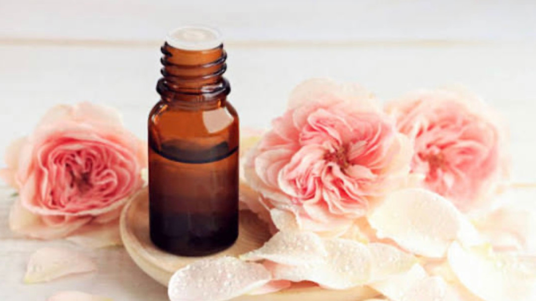 rose essential oil benefits for skin mood and wellness with natural self care products