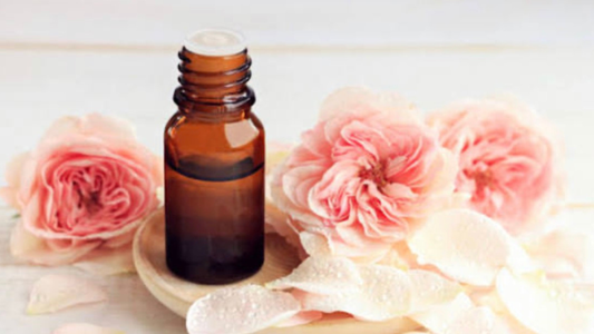 rose essential oil benefits for skin mood and wellness with natural self care products