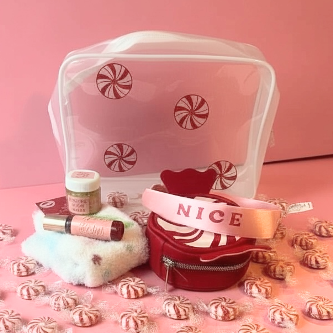 Clear mesh bag with candy cane design on a pink background with small candy canes.