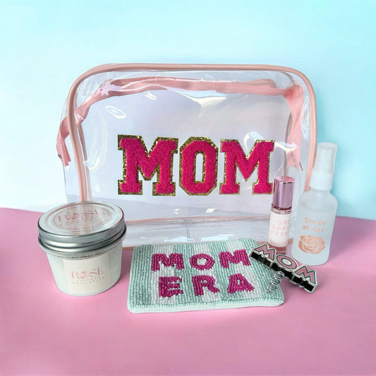 Mom Era wellness gift bundle with rose bath salts, rose face mist, MOM cosmetic bag, Mom Era Beaded change purse, botanical perfume and mom wine opener.