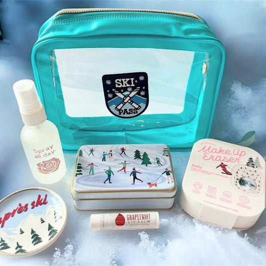 Après Ski wellness bundle with rose face spray, natural lip balm, trinket tin, makeup eraser and trinket dish styled in snow
