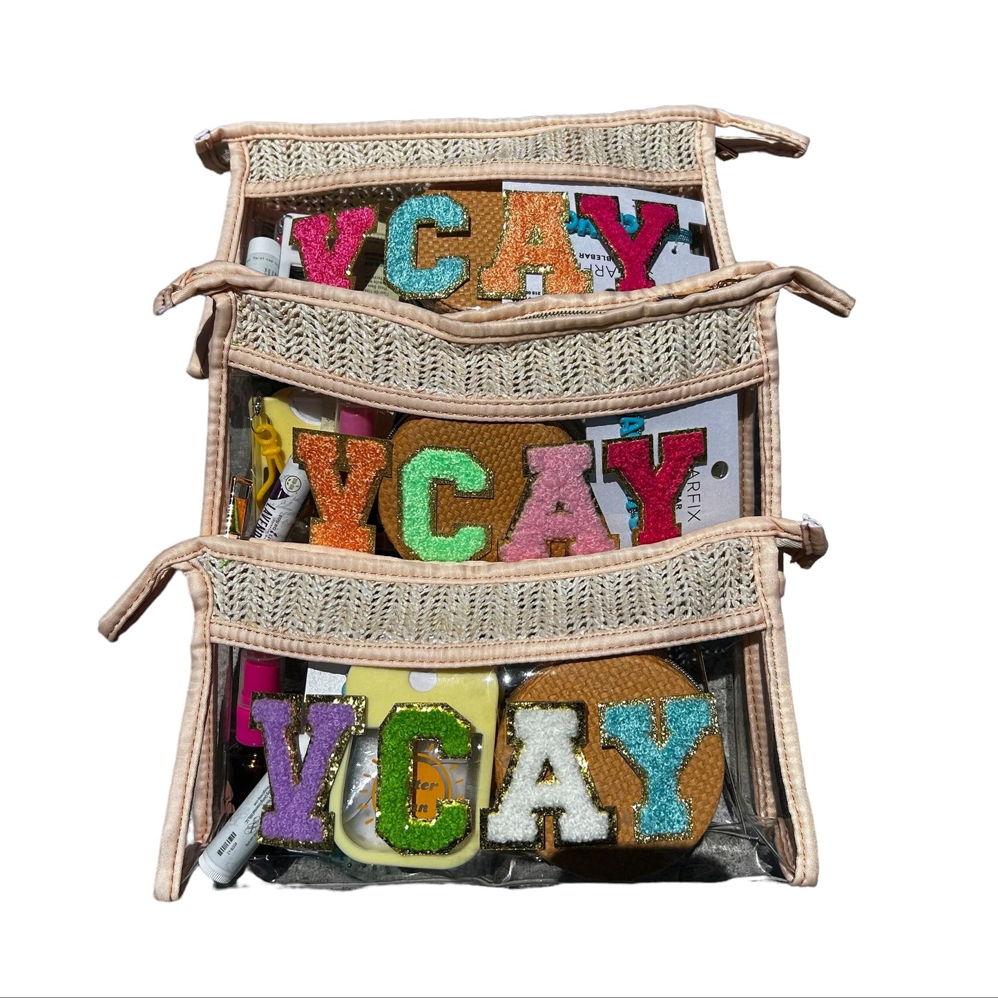 Clear straw cosmetic bags personalized with colorful chenille varsity letters spelling VACAY