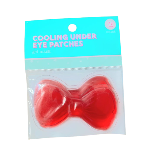 Cooling under-eye gel patches in a red bow shape for reducing puffiness and refreshing tired eyes. Reusable gel eye mask for self-care, spa gifts, travel, and wellness gift bundles.