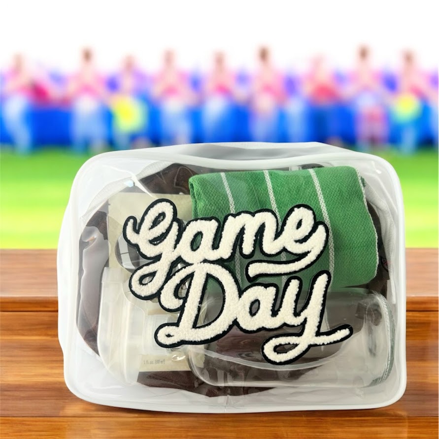Game Day football gift bag with football potholder, field dish towel, spray bottle and Thieves cleaner sample