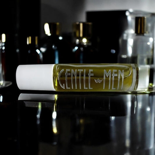 Gentlemen roll-on cologne bottle with a clean masculine fragrance displayed on a dark reflective surface.