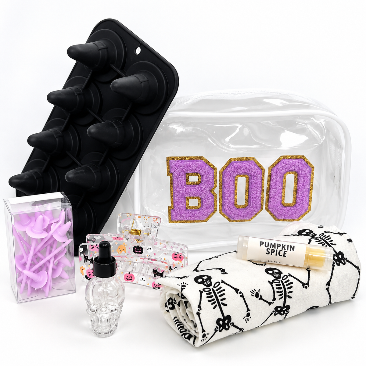 Purple BOO Halloween Wellness Gift Bundle with skeleton dish towel, pumpkin spice lip balm, skull bottle, ice mold and seasonal accessories