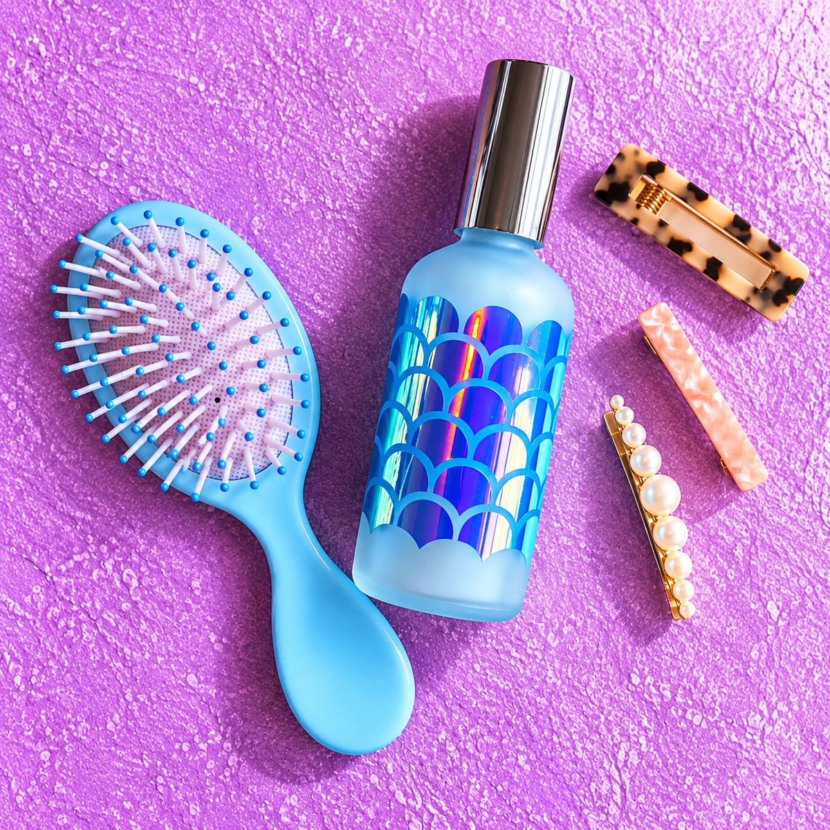 Mermaid Hair Detangler Spray with brush for beach, pool and vacation hair care by Vinyl & Oil.