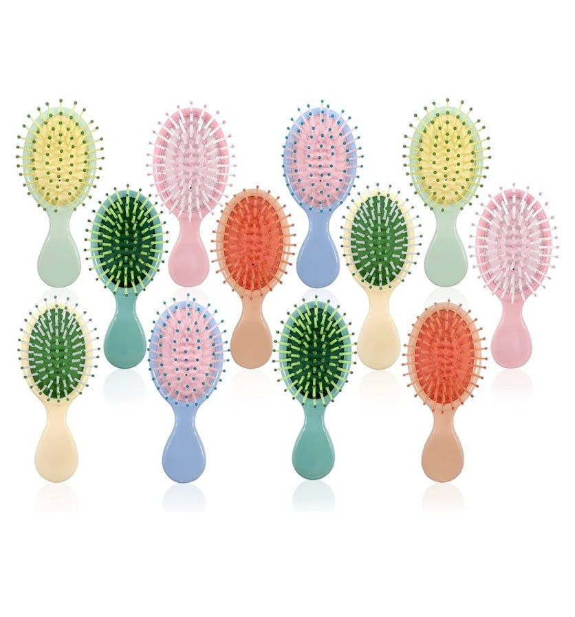colors.jpg
Assorted colorful mini detangling hair brushes in pink, blue, green, yellow and coral.
