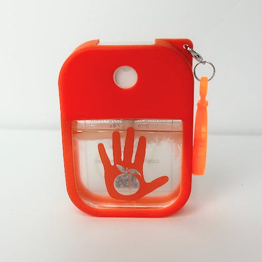 Orange Citrus Hand Sanitizer Travel Spray in a refillable bottle with silicone clip for clean hands and wellness on the go.