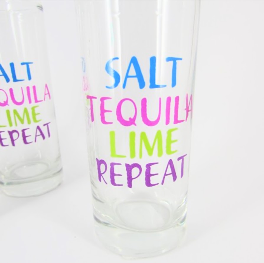 Colorful "Salt Tequila Lime Repeat" drinking glass included in the Marg Wellness Gift Bundle.