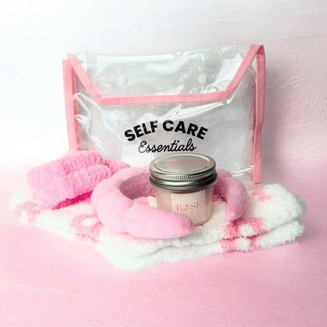 Self care wellness bundle with rose bath salts cozy spa socks spa headband wristbands and clear self care essentials bag