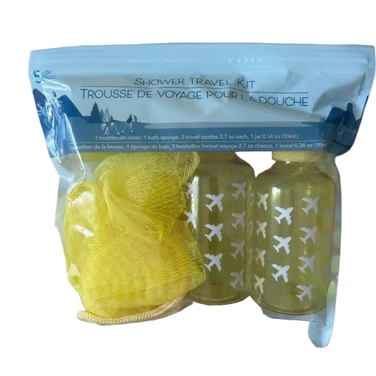 “Travel shower kit with airplane-print travel bottles, yellow bath sponge, and toiletry accessories in reusable zip pouch